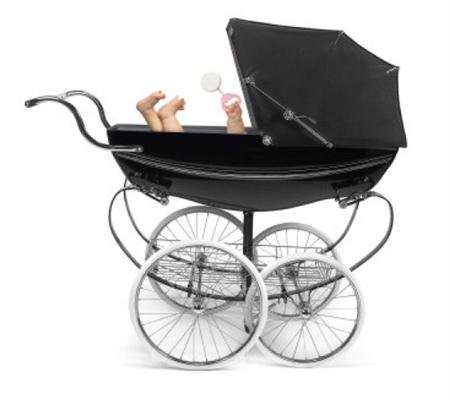 Profile of traditional baby stroller/perambulator with baby arm and feet