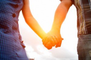 young couple holding hands